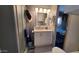 Bathroom featuring modern vanity, mirror and walk in shower creating comfort and ease at 1284 S Sioux Dr # 1284, Apache Junction, AZ 85119