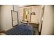 Cozy bedroom featuring a comfortable bed and access to the bathroom at 1284 S Sioux Dr # 1284, Apache Junction, AZ 85119