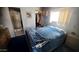 Bedroom with adjoining bathroom, closet, and window offering space and natural light at 1284 S Sioux Dr # 1284, Apache Junction, AZ 85119