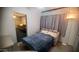 Bedroom features a comfortable bed and warm lighting for a cozy atmosphere at 1284 S Sioux Dr # 1284, Apache Junction, AZ 85119