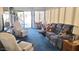 Bright living room featuring comfortable seating and sliding door access at 1284 S Sioux Dr # 1284, Apache Junction, AZ 85119