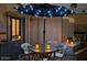 Inviting patio area featuring outdoor seating and decorative lighting for evening gatherings at 1284 S Sioux Dr # 1284, Apache Junction, AZ 85119