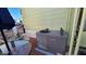 View of the patio with a table and air conditioning unit next to the exterior wall of the home at 1284 S Sioux Dr # 1284, Apache Junction, AZ 85119