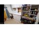 Well organized utility room with ample shelving and workspace, perfect for projects at 1284 S Sioux Dr # 1284, Apache Junction, AZ 85119