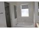 Bright bathroom features a soaking tub and shower at 1417 W Lake Mirage Ct, Gilbert, AZ 85233