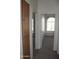 Hallway with carpeted floors and multiple doorways leading to different rooms at 1417 W Lake Mirage Ct, Gilbert, AZ 85233
