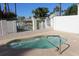 Inviting community hot tub with clear water, a safety railing, and surrounding palm trees at 1417 W Lake Mirage Ct, Gilbert, AZ 85233