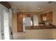 Well-lit kitchen features granite counters, white appliances, and ample cabinet space at 1417 W Lake Mirage Ct, Gilbert, AZ 85233