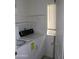 Bright laundry room with washer, dryer, storage shelves and window at 1417 W Lake Mirage Ct, Gilbert, AZ 85233