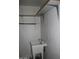 Utility sink and shelving provide extra storage space in the laundry room at 1417 W Lake Mirage Ct, Gilbert, AZ 85233