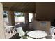 Covered pool area with tables, chairs, and posted pool rules for community members at 1417 W Lake Mirage Ct, Gilbert, AZ 85233