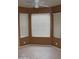 The room has tile flooring, three sunny windows, and neutral colored walls at 1417 W Lake Mirage Ct, Gilbert, AZ 85233