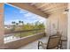 View from a private balcony with seating and view of palm trees and surrounding desert landscape at 14645 N Fountain Hills N Blvd # 215, Fountain Hills, AZ 85268