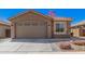 Charming single-Gathering home featuring a two-car garage and stone accents with easy to maintain desert landscaping at 16573 W Alameda Rd, Surprise, AZ 85387