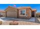 Beautiful single-Gathering home with a two-car garage, stone accents, and pretty desert landscaping at 16573 W Alameda Rd, Surprise, AZ 85387