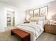 Serene bedroom with soft lighting, plush bedding, and tasteful artwork creating a relaxing retreat at 17633 W Pierson St, Goodyear, AZ 85395