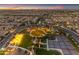 Community aerial view with a community center, swimming pool, tennis courts, and green spaces at 187 E Santa Lucia Ln, Queen Creek, AZ 85140