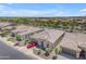 Aerial view of a suburban home with a red sports car, showcasing its location and surrounding neighborhood at 187 E Santa Lucia Ln, Queen Creek, AZ 85140