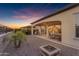 Covered back patio with outdoor dining, lounge seating, a grill, and an outdoor fire pit at 187 E Santa Lucia Ln, Queen Creek, AZ 85140