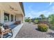 Expansive backyard with a covered patio, desert landscaping, and a peaceful atmosphere for outdoor enjoyment at 187 E Santa Lucia Ln, Queen Creek, AZ 85140