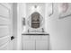 Elegant powder room with stylish mirror, modern sink, and white vanity, creating a clean and inviting space at 187 E Santa Lucia Ln, Queen Creek, AZ 85140