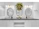 Elegant bathroom with double sinks, stylish mirrors, and ample storage space, offering a clean and functional design at 187 E Santa Lucia Ln, Queen Creek, AZ 85140