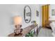 Stylish bedroom with a wooden console table, decorative mirror, and modern accents, creating a cozy and inviting space at 187 E Santa Lucia Ln, Queen Creek, AZ 85140