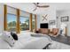 Bright bedroom with large windows, stylish curtains, and comfortable furnishings creates a welcoming and relaxing space at 187 E Santa Lucia Ln, Queen Creek, AZ 85140