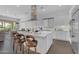 Bright kitchen featuring island seating, stainless appliances, and an open design for easy entertaining, with a back yard view at 187 E Santa Lucia Ln, Queen Creek, AZ 85140