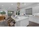 Modern kitchen featuring a large island with bar seating, stainless steel hood, and sleek white cabinetry at 187 E Santa Lucia Ln, Queen Creek, AZ 85140