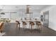 Open kitchen with a large island, barstools, and stainless appliances, blending style and functionality seamlessly at 187 E Santa Lucia Ln, Queen Creek, AZ 85140