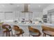 Contemporary kitchen features a large island with bar seating and modern finishes, creating an inviting space at 187 E Santa Lucia Ln, Queen Creek, AZ 85140