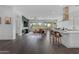 Open-concept living space flows from the kitchen to the living room with backyard view, and seamlessly connects entertainment at 187 E Santa Lucia Ln, Queen Creek, AZ 85140