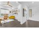Stylish living area with a yellow sofa, decorative shelves, and modern furnishings creating an inviting space at 187 E Santa Lucia Ln, Queen Creek, AZ 85140