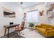 Chic office featuring a sleek desk, comfortable seating, area rug, and an abundance of natural light at 187 E Santa Lucia Ln, Queen Creek, AZ 85140