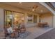 Inviting covered patio with outdoor seating, ideal for relaxing and enjoying the beautiful Arizona evenings at 187 E Santa Lucia Ln, Queen Creek, AZ 85140
