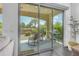 Inviting outdoor patio featuring a seating area, rocking chairs, barbecue, and views of the landscaped backyard at 187 E Santa Lucia Ln, Queen Creek, AZ 85140
