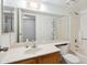 Cozy bathroom featuring a vanity with sink, toilet, mirror, and shower/tub combination at 18811 N 19Th Ave # 3015, Phoenix, AZ 85027