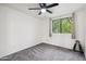 Light-filled bedroom with neutral walls, carpeted floor, and a window providing natural light at 18811 N 19Th Ave # 3015, Phoenix, AZ 85027