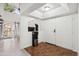 Bright entrance with double doors, high ceiling, wood-look flooring, and staircase to the side at 18811 N 19Th Ave # 3015, Phoenix, AZ 85027