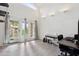Bright living room with wood-look floors, tall windows, and contemporary décor at 18811 N 19Th Ave # 3015, Phoenix, AZ 85027