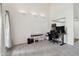 Spacious living room with light-colored flooring, recessed lighting, and a desk workspace at 18811 N 19Th Ave # 3015, Phoenix, AZ 85027
