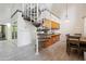 Open-concept living space featuring a spiral staircase, and light wood-look flooring at 18811 N 19Th Ave # 3015, Phoenix, AZ 85027