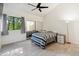 Main bedroom featuring ample light, ceiling fan, and mirrored closet doors at 18811 N 19Th Ave # 3015, Phoenix, AZ 85027