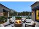 Inviting backyard with a fire pit, patio seating, and a sparkling pool in the background at 18916 N 98Th St # 3709, Scottsdale, AZ 85255