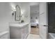 Stylish bathroom with gray vanity and stone countertop adjacent to a bedroom with natural light at 18916 N 98Th St # 3709, Scottsdale, AZ 85255