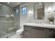 Modern bathroom boasts a glass shower, sleek gray vanity, and contemporary fixtures at 18916 N 98Th St # 3709, Scottsdale, AZ 85255