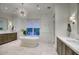 Luxurious bathroom featuring double vanities, a standalone tub, and stylish lighting at 18916 N 98Th St # 3709, Scottsdale, AZ 85255