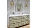 Elegant powder room features a custom vanity with marble countertop and decorative mirror at 18916 N 98Th St # 3709, Scottsdale, AZ 85255