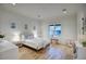 Bright bedroom with ample natural light features a cozy bed, stylish decor, and wood floors at 18916 N 98Th St # 3709, Scottsdale, AZ 85255